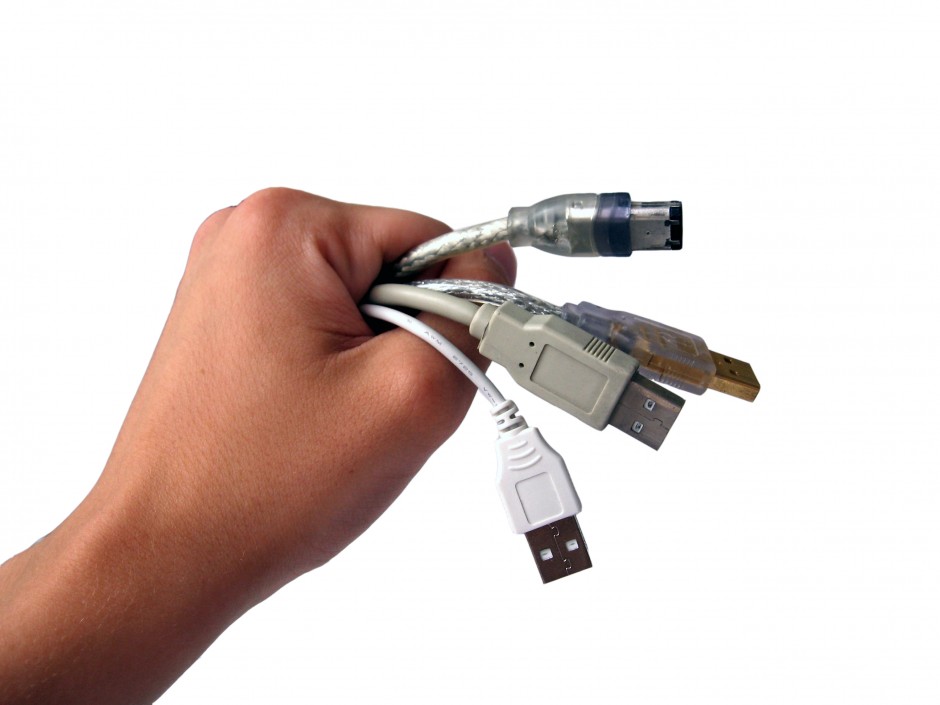 hand holding a bundle of usb cables